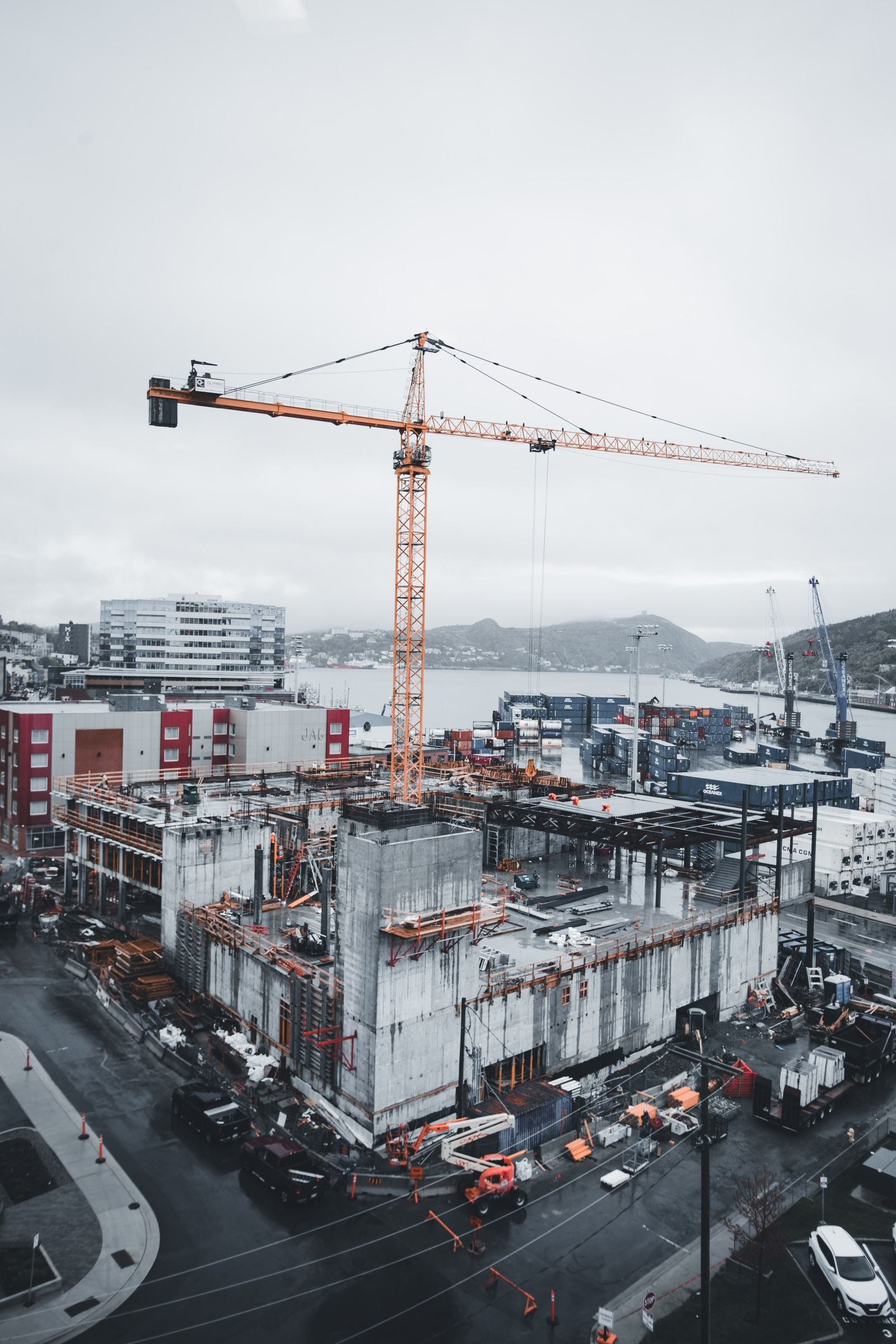 Construction photograph: Erik Mclean / Pexels. Illustrative stock; not a company project.