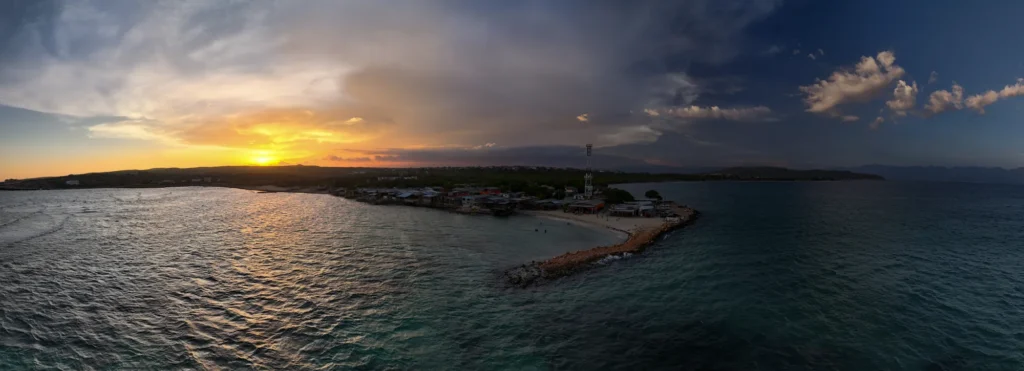 Sunset over the sea and a coastal inlet
