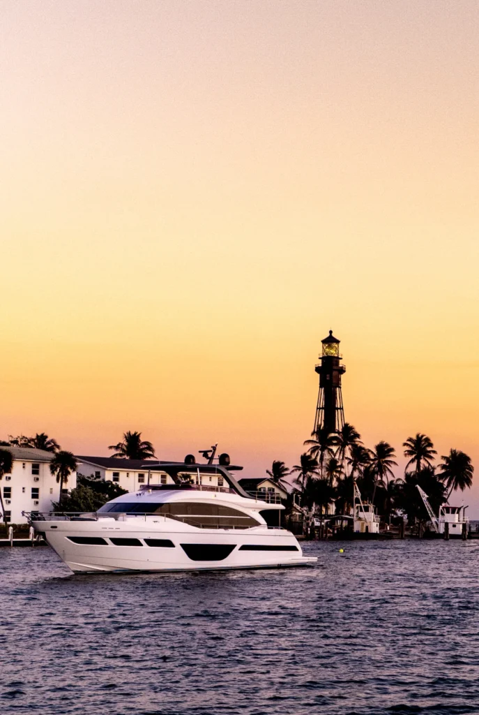 Yacht and lighthouse in warm evening light