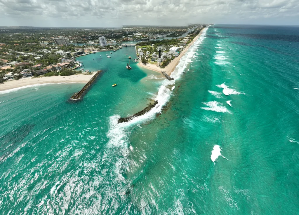 Wide aerial view of a shoreline and inlet