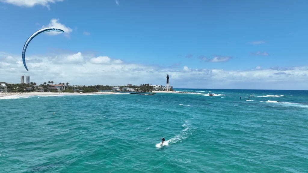 Kiteboarding across coastal water