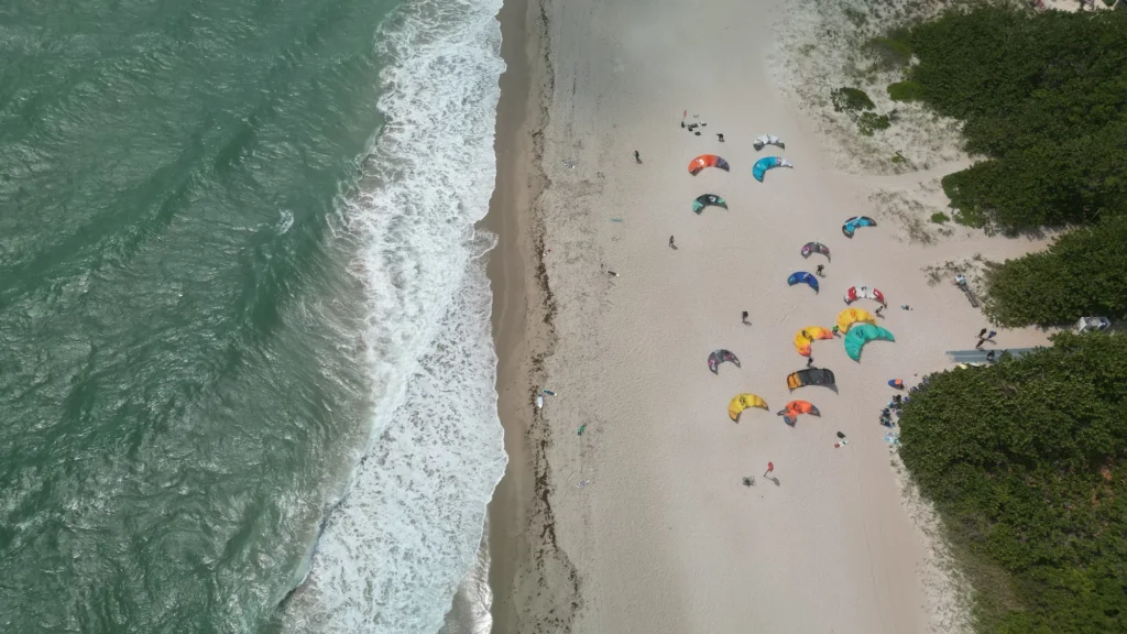Overhead view of beach umbrellas and surf