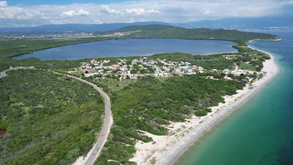 Coastline, open land and a winding road