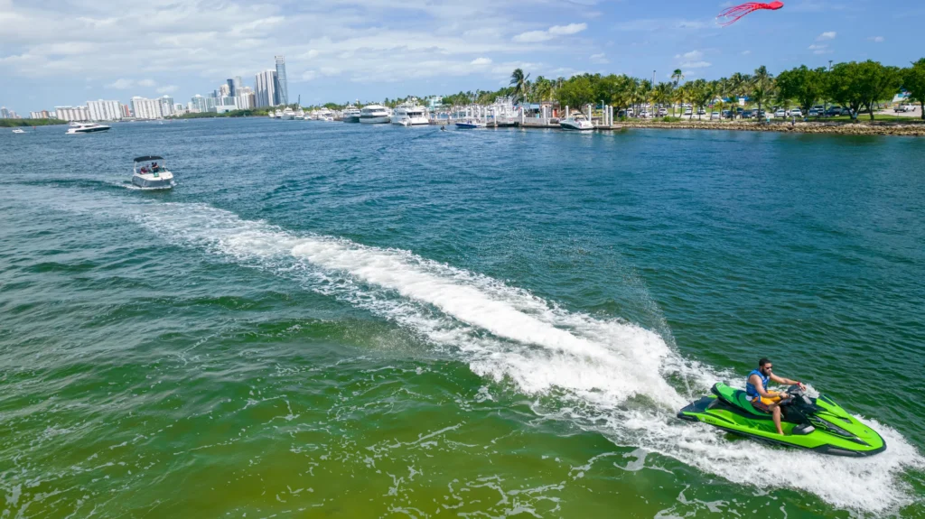 Personal watercraft moving through coastal water