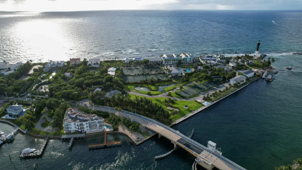 Coastal neighborhood, waterway and bridge at dusk