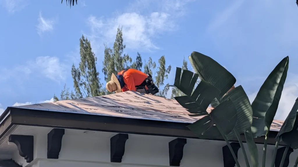 Roof workers and installation detail