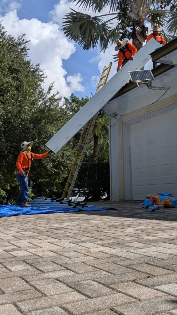 Moving a roof panel toward the building