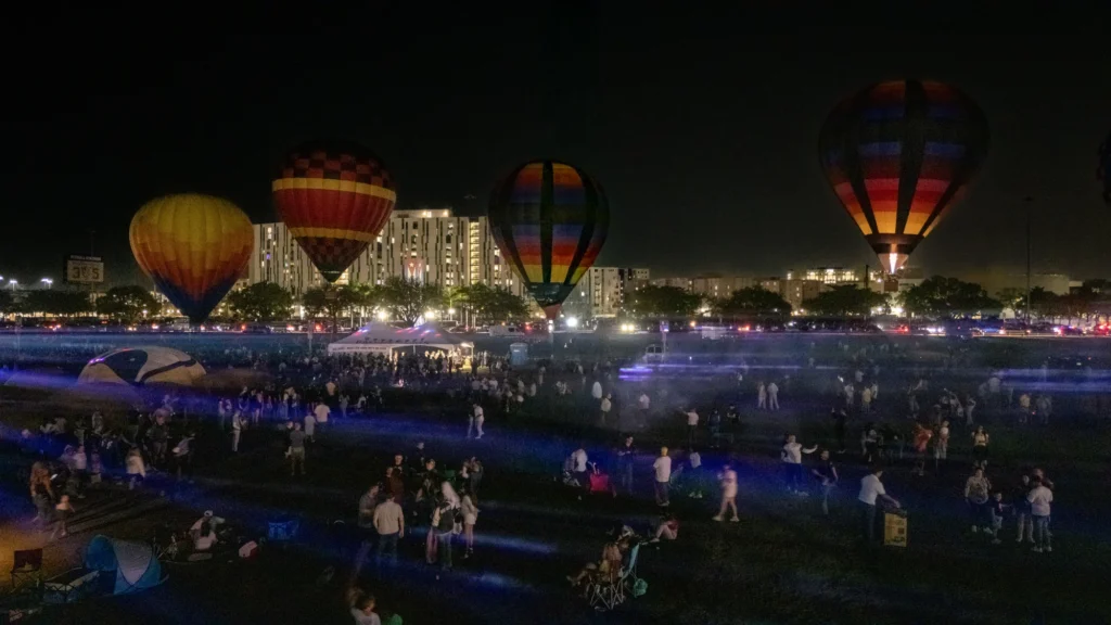 Nighttime event grounds with illuminated balloons