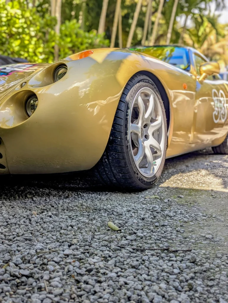 Low-angle detail of a gold sports car