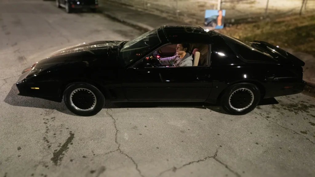 Black car photographed at night
