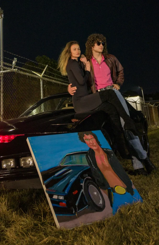 Nighttime portrait beside a black car