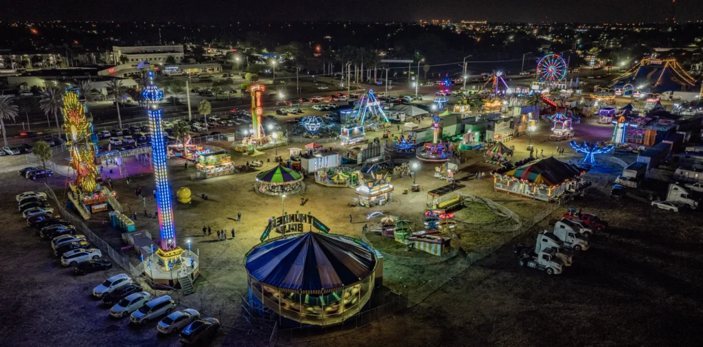 Illuminated fairground at night