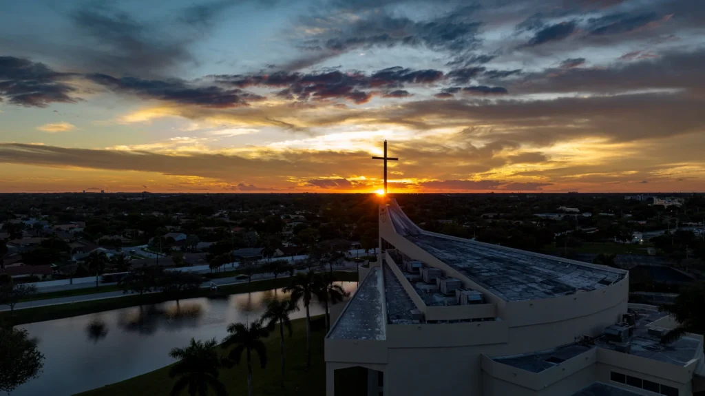 Venue roofline and water at sunset