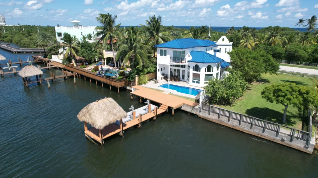 Blue waterfront home and private dock