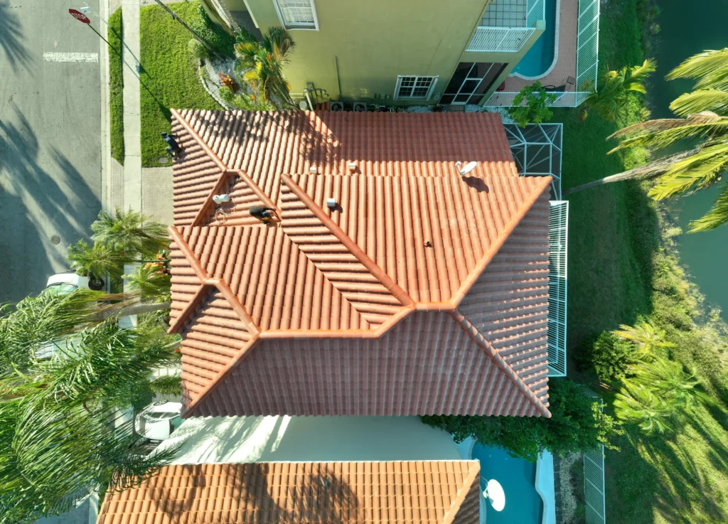 Overhead view of tiled roofs and surrounding property