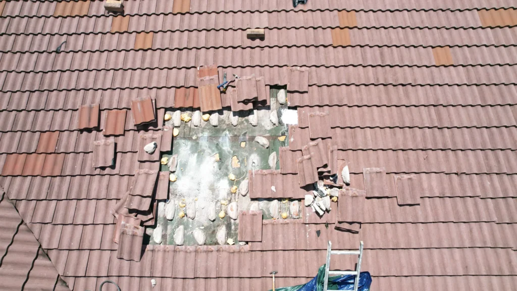 Roof repair area within a tiled roof